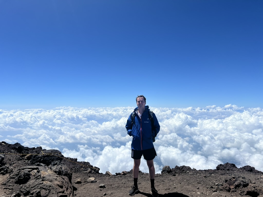 Alistair Kenyon-Brodie at the summit of Mt Fuji, above the clouds